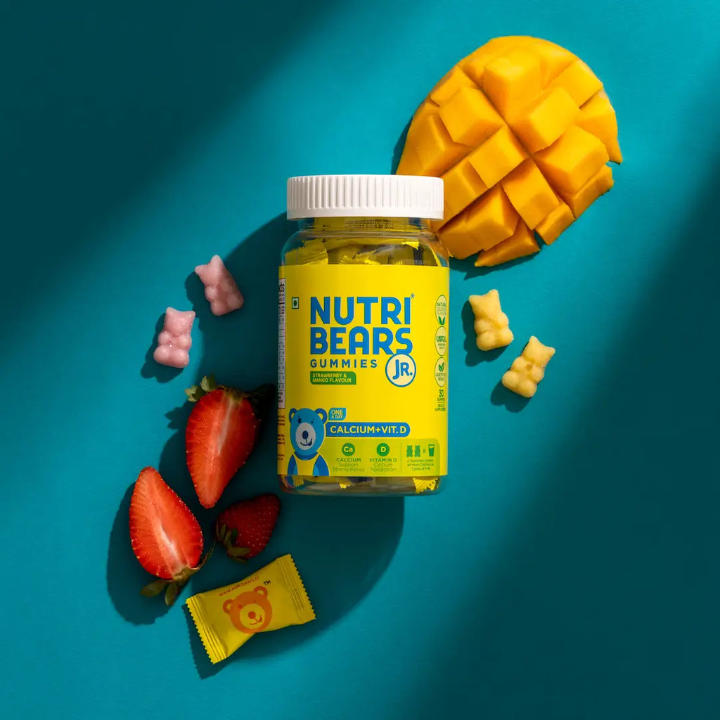 Bottle of NutriBears gummy vitamins with gummies scattered around, illustrating the convenience of gummies over powder supplements