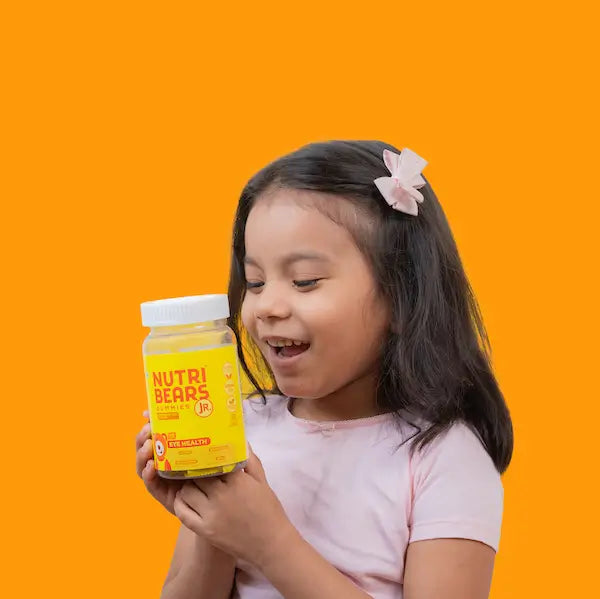 Kid taking NutriBears Eye Gummies - Promoting Healthy Vision